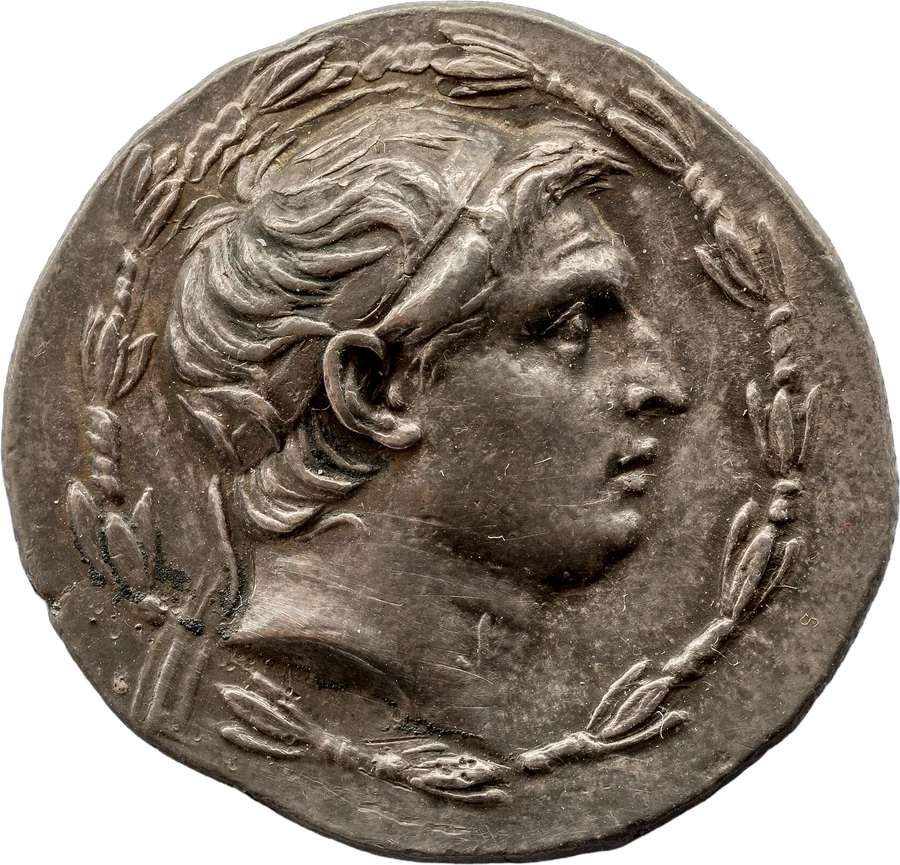 A silver coin carrying the head of a Hellenistic king inside a wreath, power in one man's face