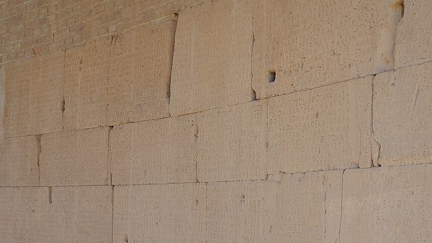 Blocks of the Gortyn law wall, closely carved with Greek letters